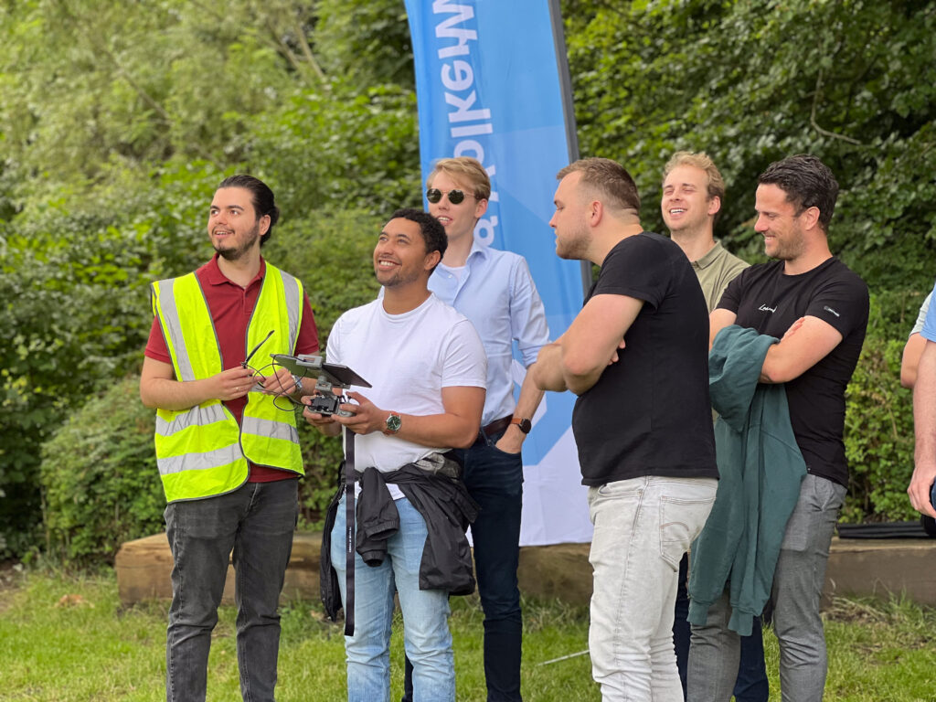 a group of men standing in grass